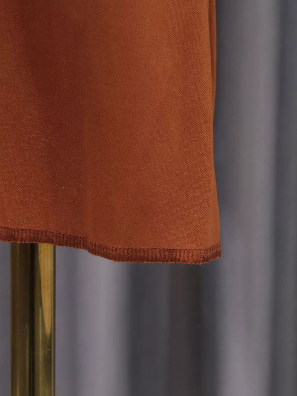 Brown maternity maxi dress hem detail with stitched edge