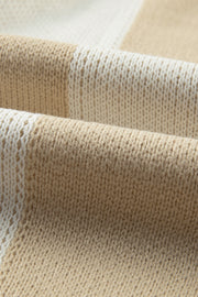 Colorblock checkerboard knit sweater in beige and cream acrylic fabric.