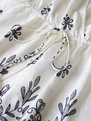 Printed Surplice Half Sleeve Romper in White, fabric detail