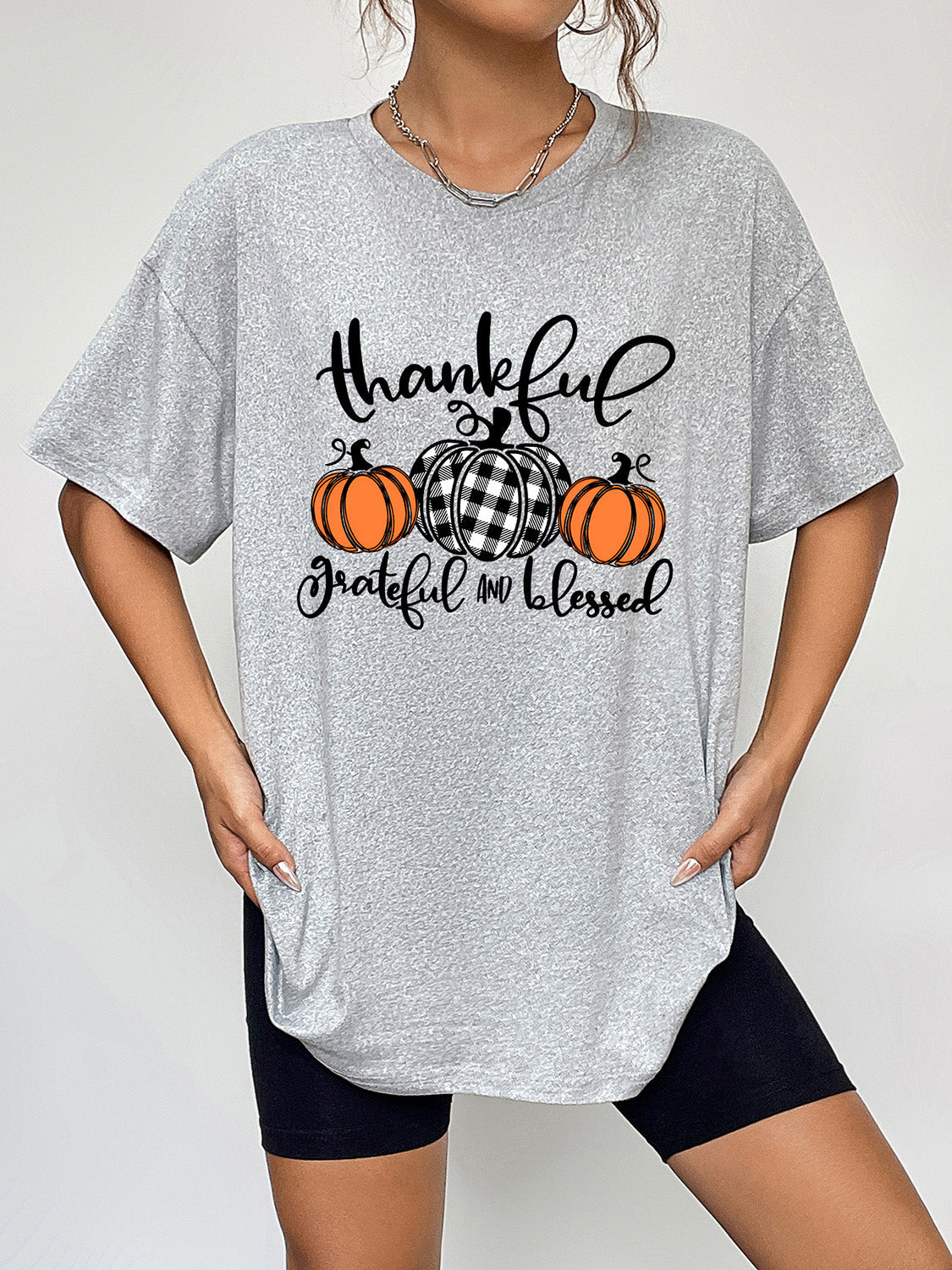 Oversized grey graphic tee with thankful pumpkins and text, crew neck, short sleeves.