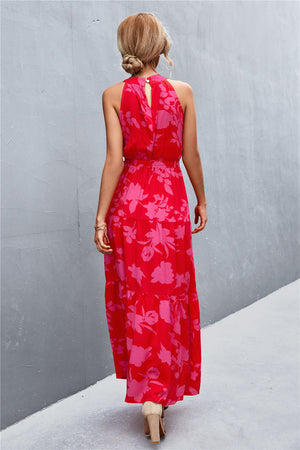 Red floral print maxi dress with halter neckline and tiered skirt.