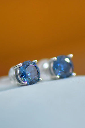 Sapphire Brilliance Platinum Stud Earrings with round blue stones.