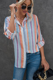 Coastal Stripe Button-Down Blouse in orange and blue with rolled sleeves.