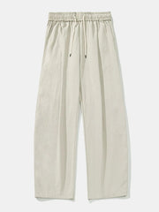 Balloon-fit drawstring trousers in light gray with a relaxed, casual style.