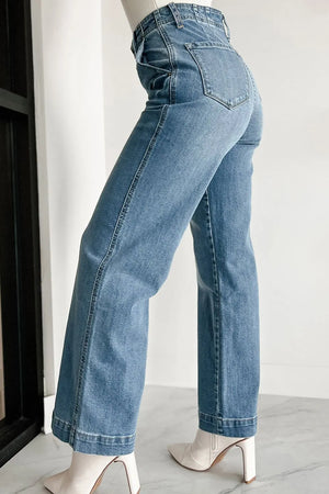 Button-fly wide-leg denim trousers in medium wash, featuring a high waist and flared leg.