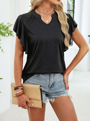 Gray tee with ruffled sleeves and notched V-neck, styled with denim shorts and a clutch.