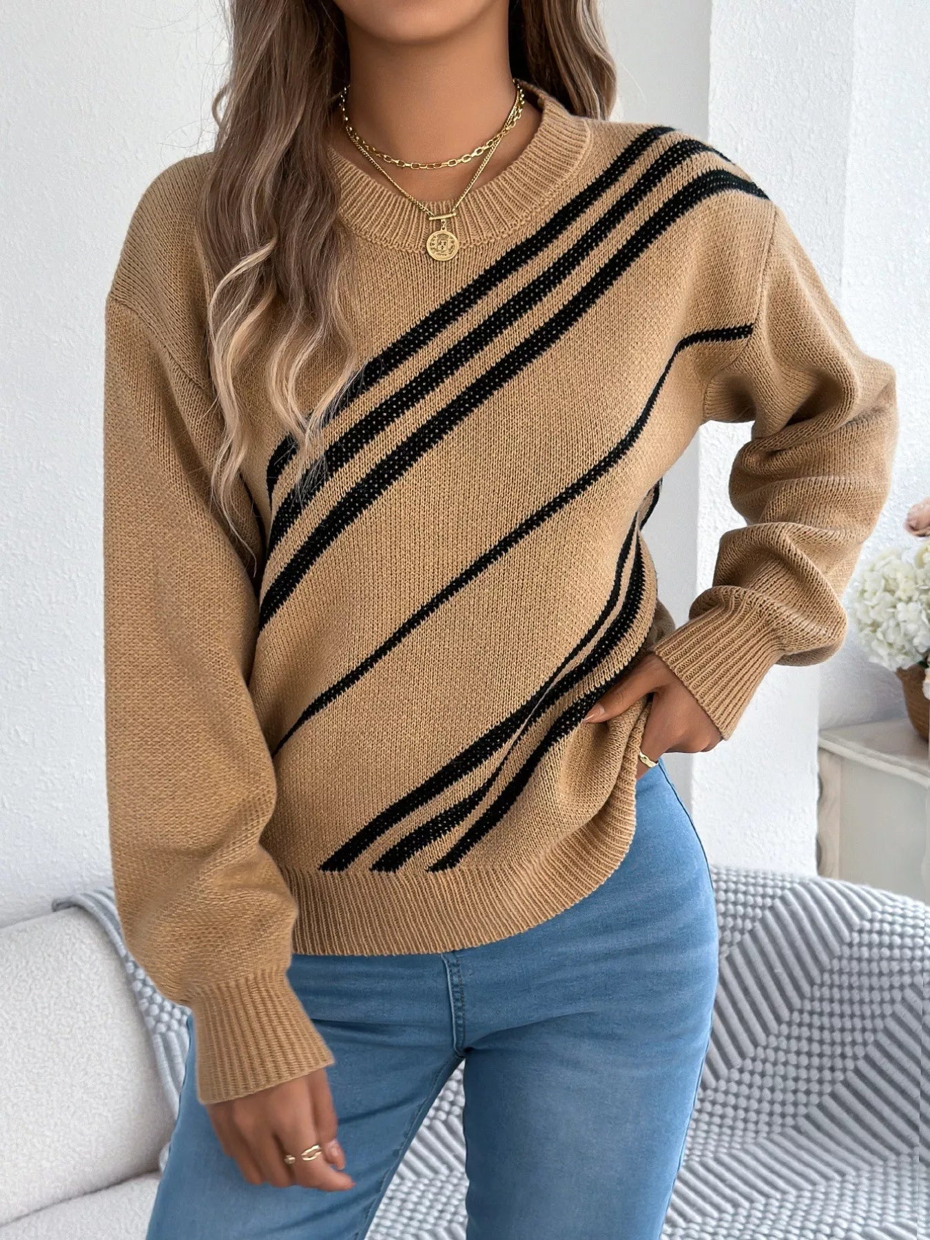 Khaki acrylic blend sweater with black diagonal stripes and round neck.