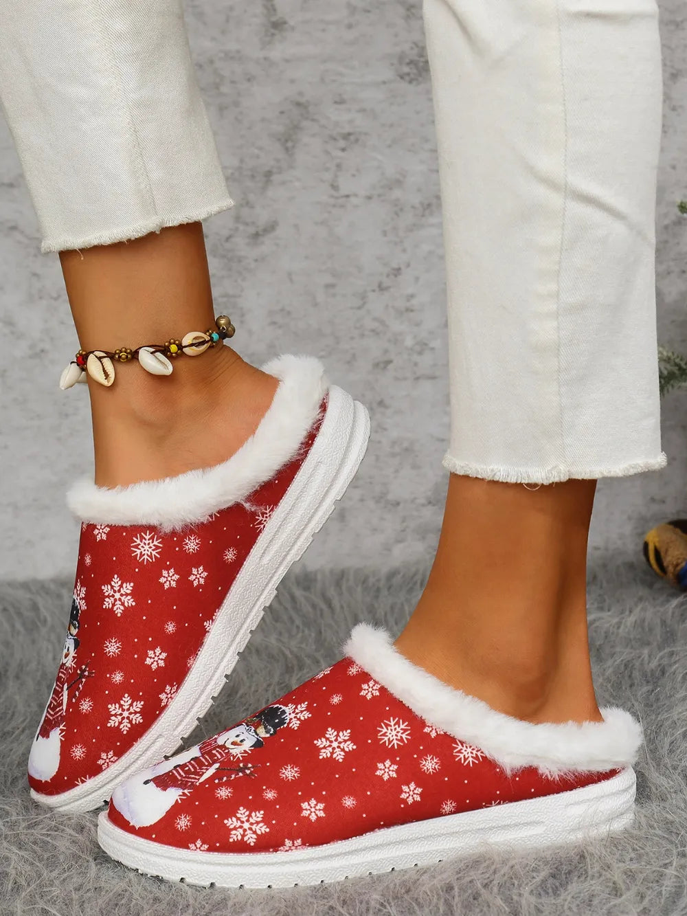 Red snowman print sherpa lined holiday slides with snowflake pattern