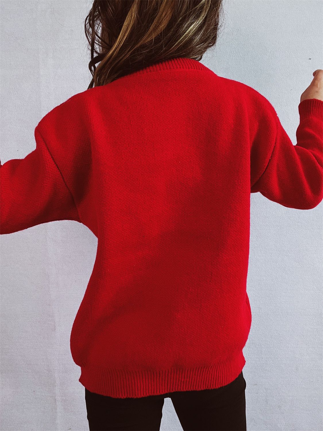 Deep Red acrylic knit sweater with crewneck and long sleeves.