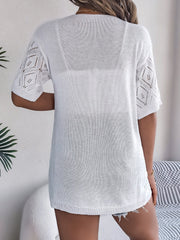 White open-knit cardigan with diamond pattern sleeves and a relaxed fit.