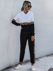 White and black colorblock loungewear set with leopard trim on sleeves and pants