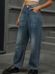 Relaxed fit denim trousers in medium wash with patchwork knee detail.