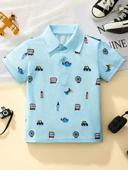 Light blue toddler polo shirt with cartoon cars and dinosaurs print