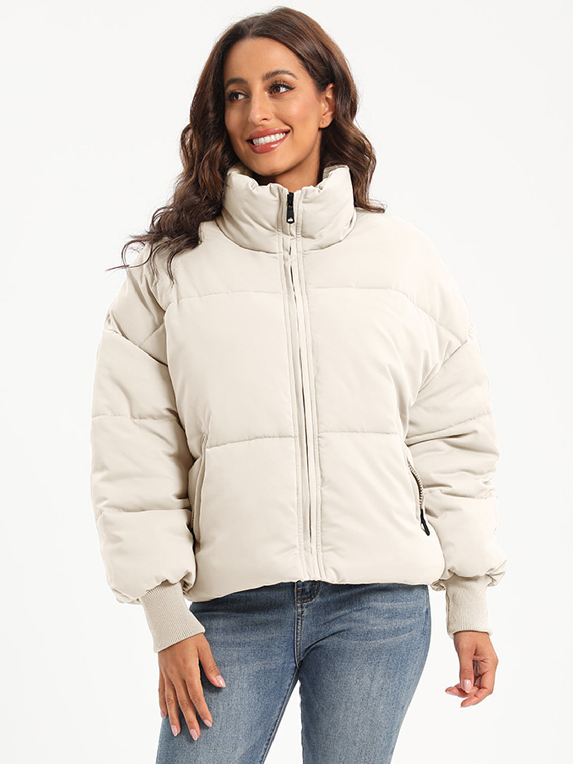 Padded bomber jacket in cream with ribbed cuffs and a high collar.