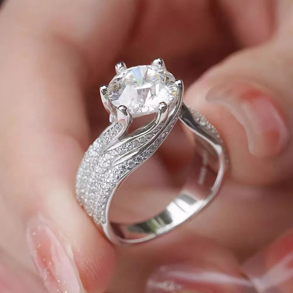 Exquisite Moissanite Solitaire Ring In Silver with pave band.