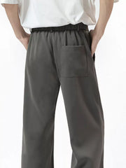 Men's dark gray sweatpants with elastic waist and a single back pocket.