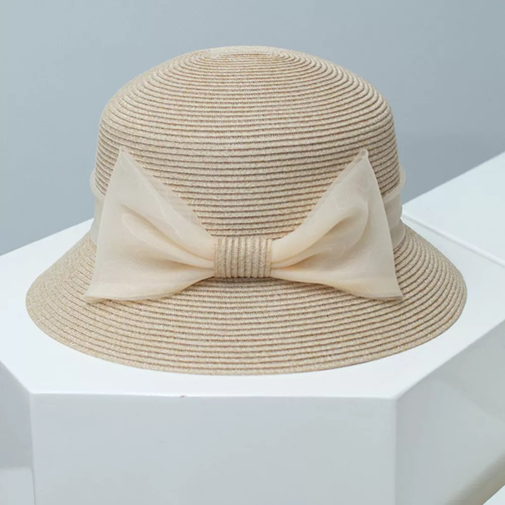 Beige straw cloche sun hat with sheer ribbon bow detail