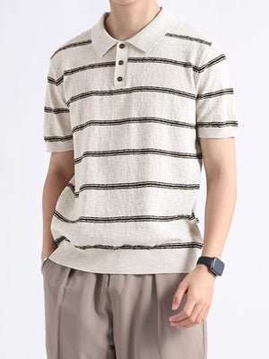 Men's striped knit polo shirt with button accents in off-white and black.