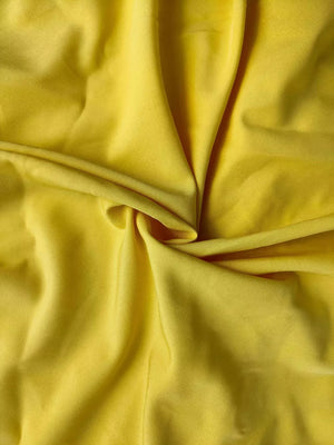 Yellow smocked maxi dress fabric detail with ruffle hem