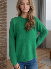 Textured knit raglan sleeve pullover in dark green with diamond pattern, crewneck, and ribbed cuffs.