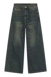 Faded dark denim wide-leg trousers with a relaxed fit and vintage wash.