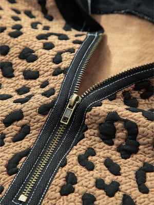 Leopard print zip hoodie with textured fabric and a bronze zipper detail.