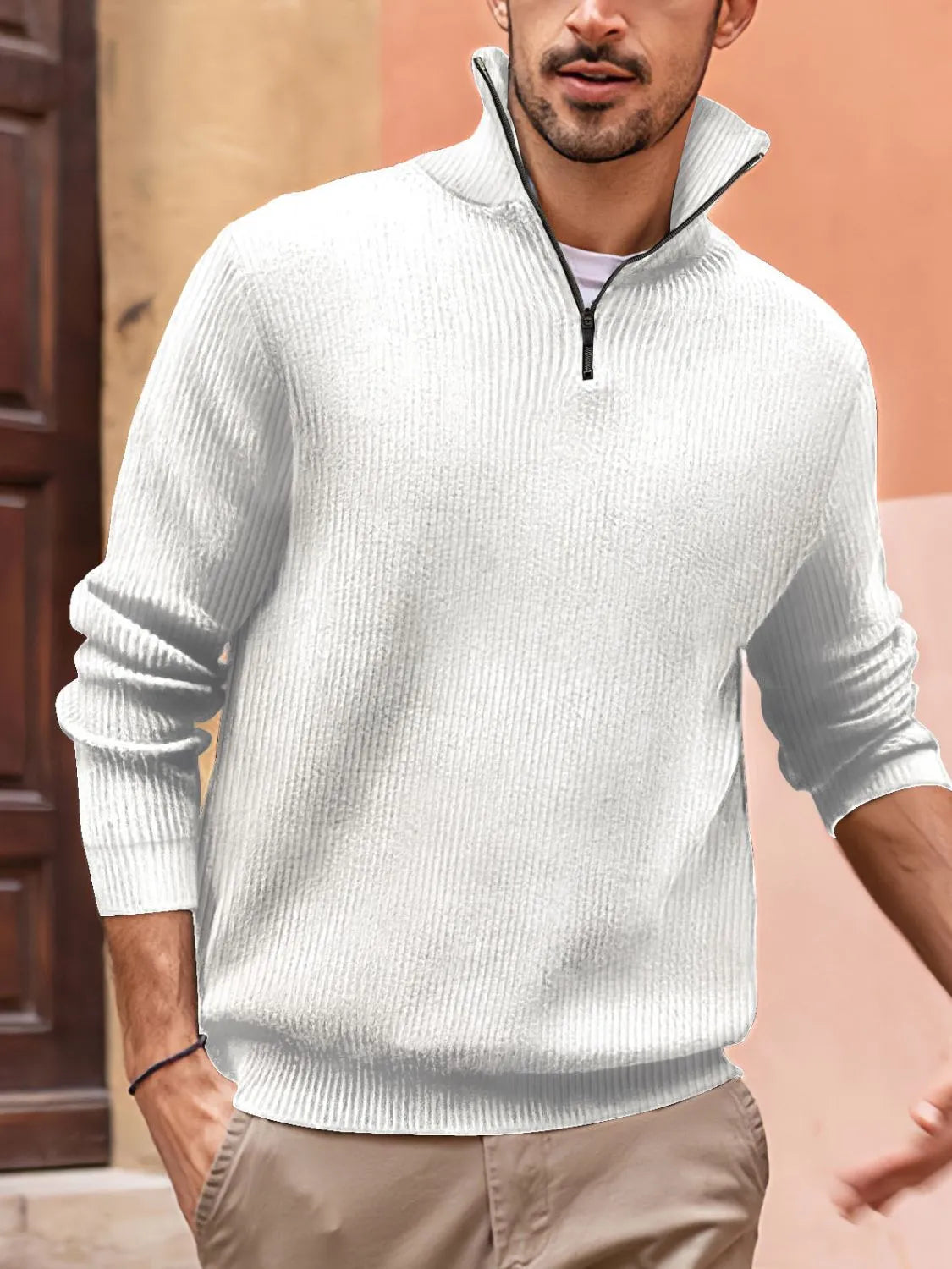 Textured ribbed quarter-zip pullover sweater in white with a stand-up collar and black zipper.