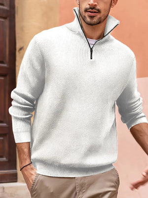 Textured ribbed quarter-zip pullover sweater in white with a stand-up collar and black zipper.