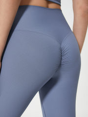 Ribbed high-waist leggings in light blue with ruched detail on the back.