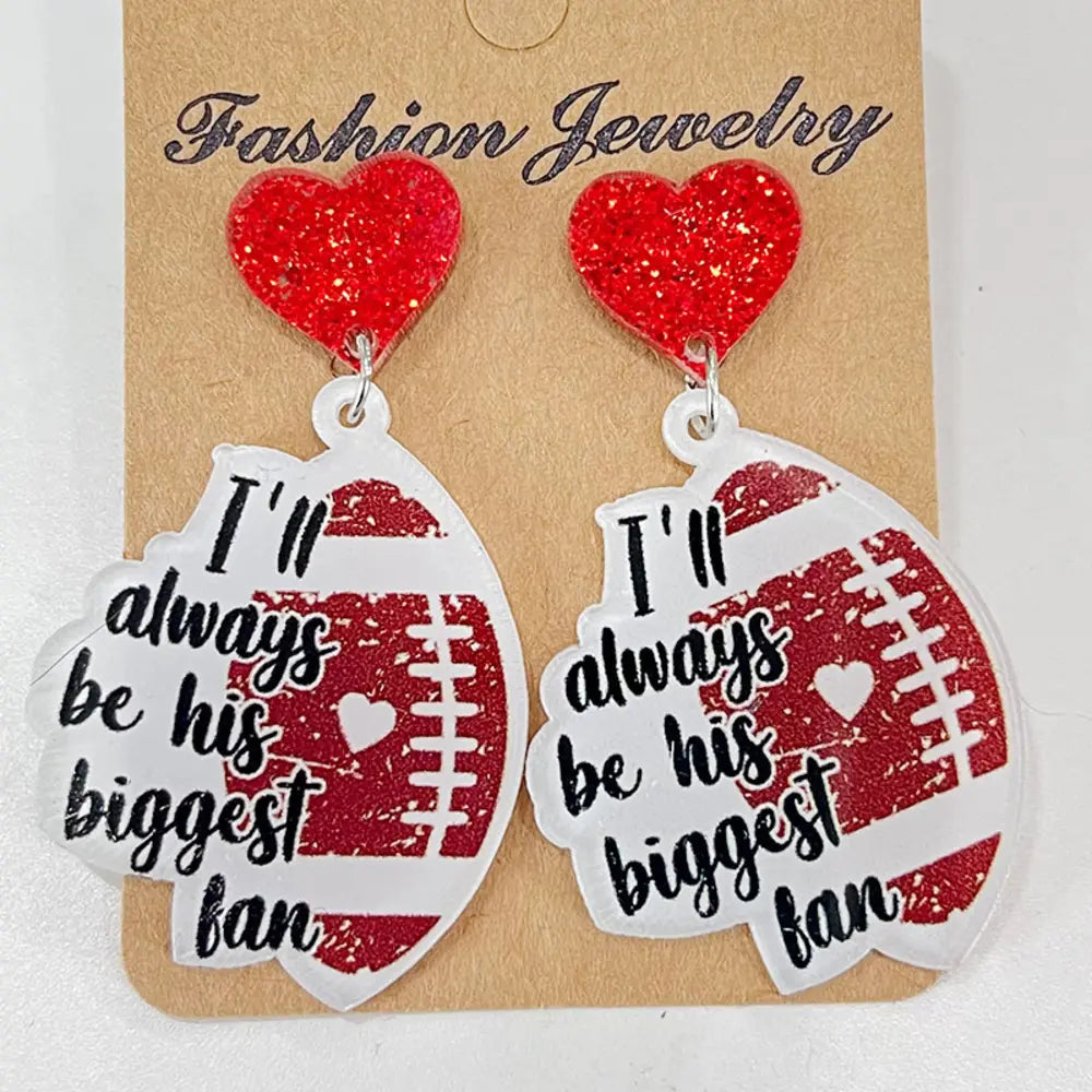 Game Day Acrylic Football Dangles with red glitter hearts and "I'll always be his biggest fan" text.