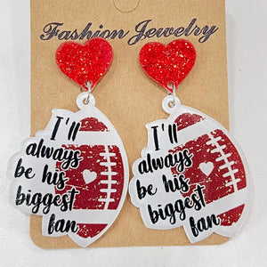 Game Day Acrylic Football Dangles with red glitter hearts and "I'll always be his biggest fan" text.