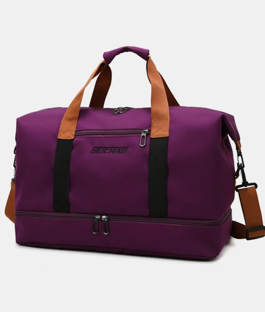 Plum purple dual-compartment weekender bag with contrast brown straps and black accents.