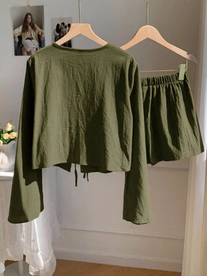 Army green cotton tie-front top with bell sleeves and matching drawstring shorts set.