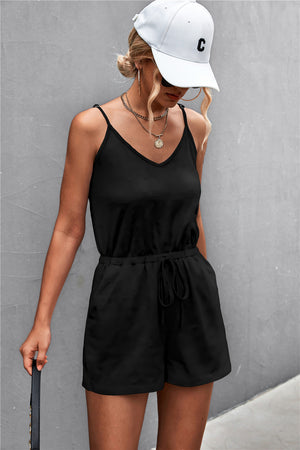 Black V-neck drawstring romper with adjustable spaghetti straps and pockets.