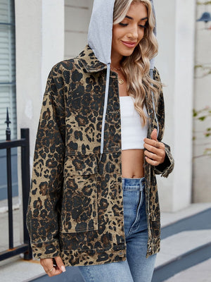 Leopard print utility denim jacket with a removable grey hood and front pockets.
