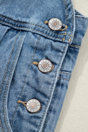 Retro wide-leg denim jumpsuit with button closure and visible stitching detail.