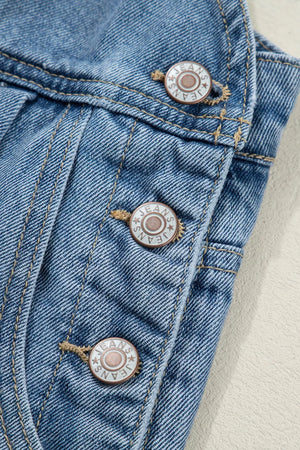 Retro wide-leg denim jumpsuit with button closure and visible stitching detail.