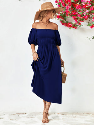Dark blue off-shoulder midi dress with gathered bodice and balloon sleeves.