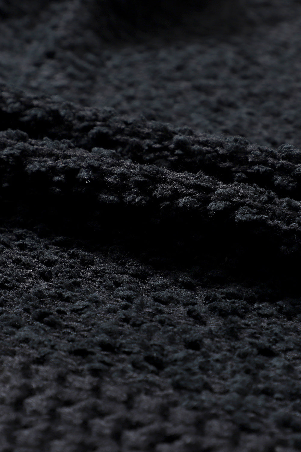 Black textured bouclé open-front jacket detail