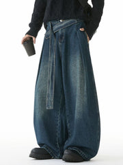 Belted relaxed fit men's jeans in vintage blue denim with a wide leg and tie waist.