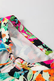 Vibrant floral print blouse with tie detail and colorful trim.