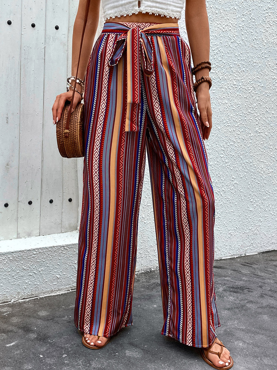 Bohemian stripe palazzo trousers in rust with tie waist and wide leg