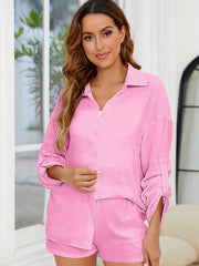 Textured cotton co-ord set in Fuchsia Pink featuring a relaxed button-up shirt with rolled sleeves and matching shorts.