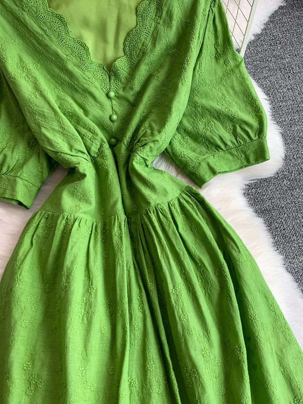 Green lace-embellished A-line midi dress with V-neck and button detail