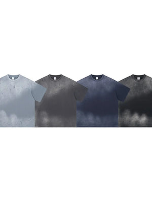 Oversized t-shirts in gray, dark gray, navy, and black with a paint splatter pattern.