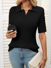 Black cable knit polo sweater with short sleeves and a collar.