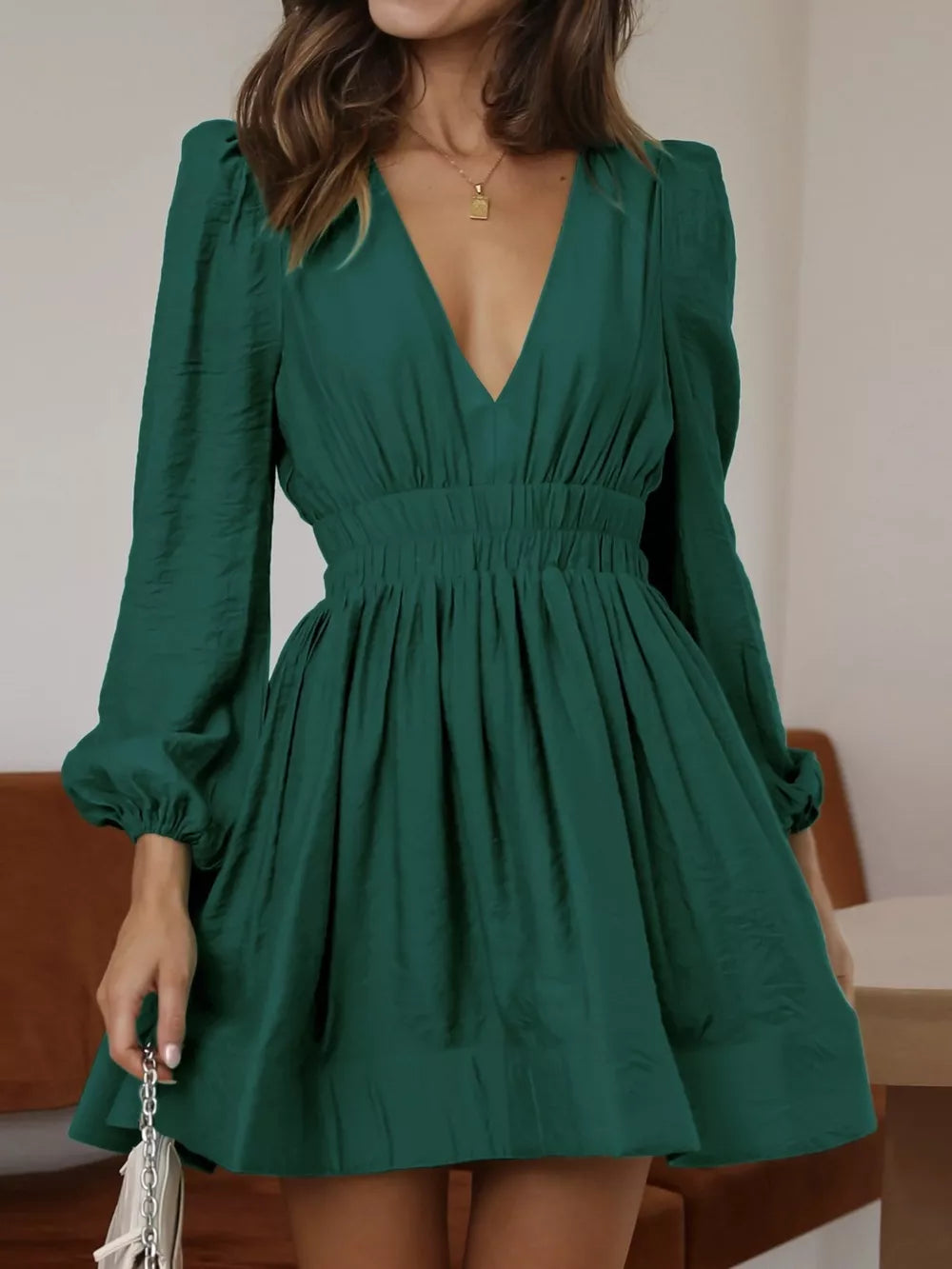 Army green V-neck mini dress with puff sleeves and cinched waist
