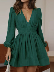 Army green V-neck mini dress with puff sleeves and cinched waist