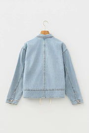 Light wash denim trucker jacket with relaxed fit and adjustable draw-cord hem.