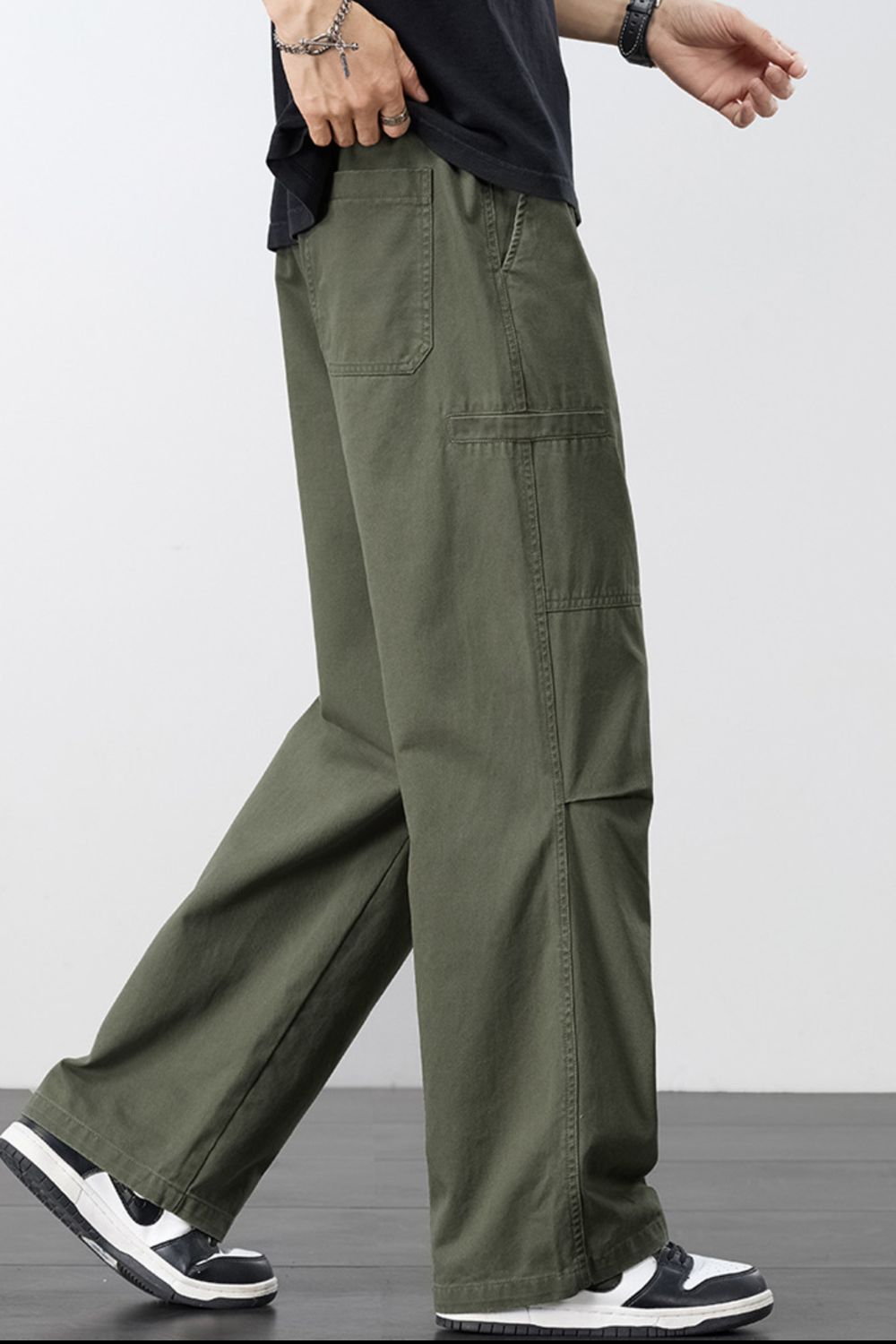 Army green cargo pants with adjustable drawstring and multiple pockets.